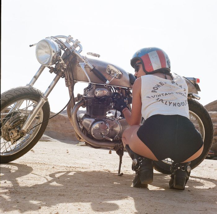 A playful frame from Girls on a motorcycle — online in Monterrey